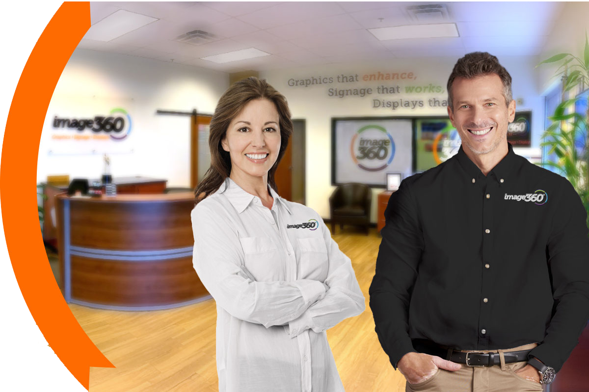 employees standing at sign company in Fort Collins
